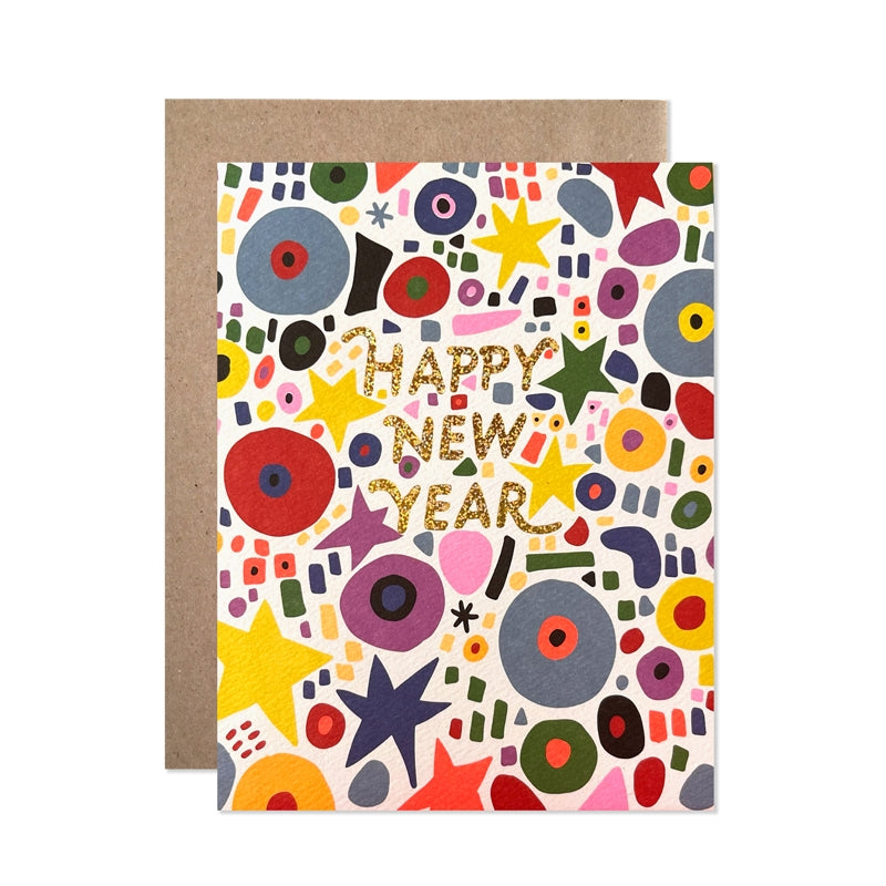 Greeting card with white background and images of circles, starts and dashes in red, blue, yellow, purple and pink. Gold foil text says, "Happy New Year". Kraft envelope included. 