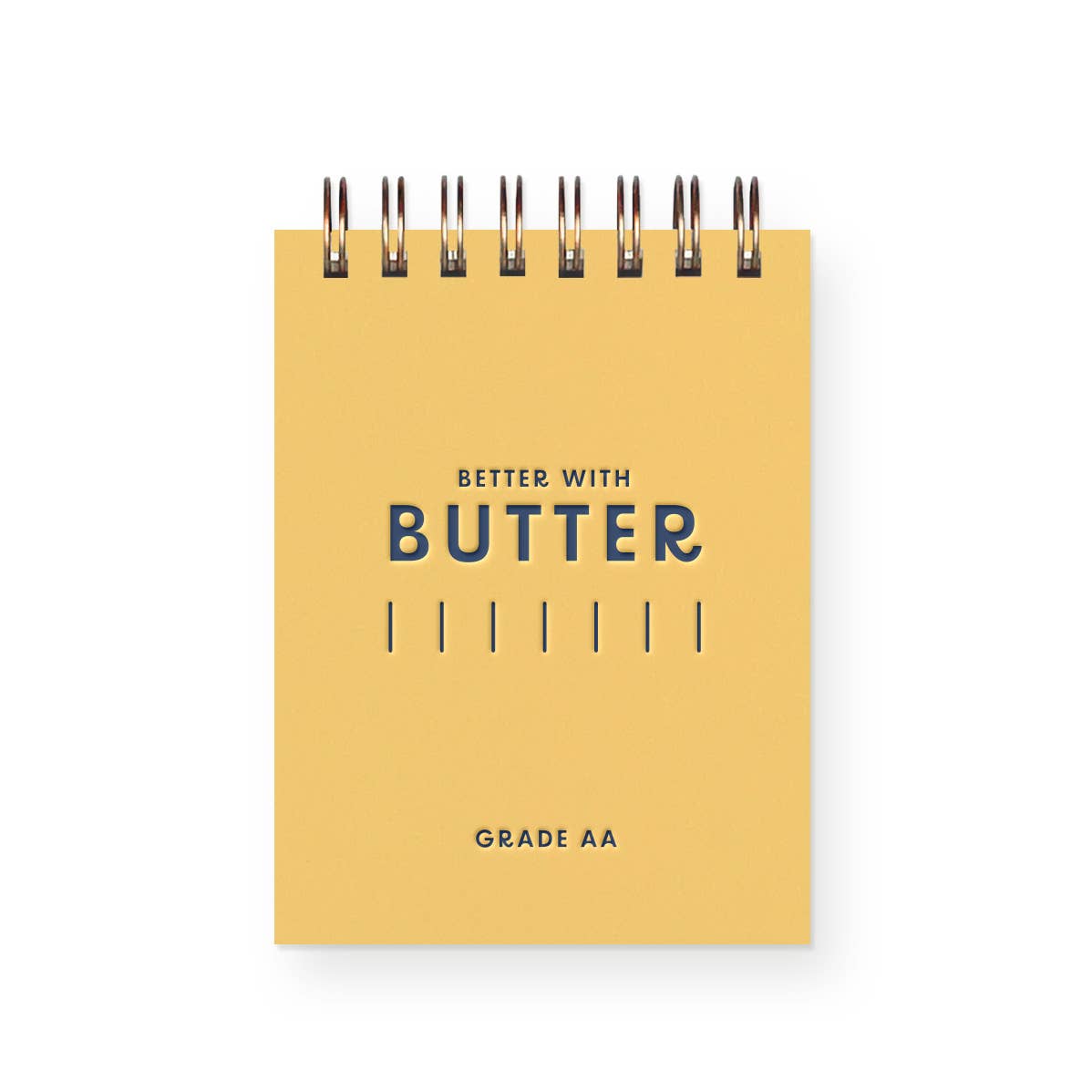 Small notepad with yellow cover and blue text says, "Better with butter" and "Grade AA" and blue lines for butter increments. 
