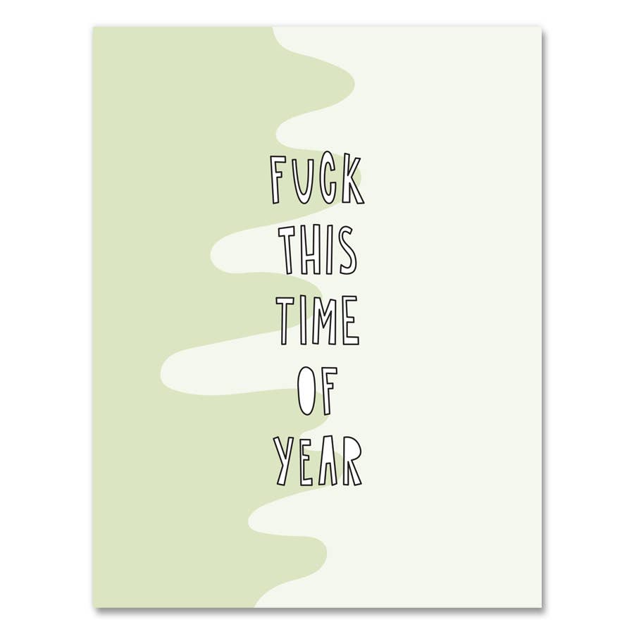 Greeting card with light green and medium green background with scallop in middle where it meets. White text says, "Fuck this time of year". Envelope included.