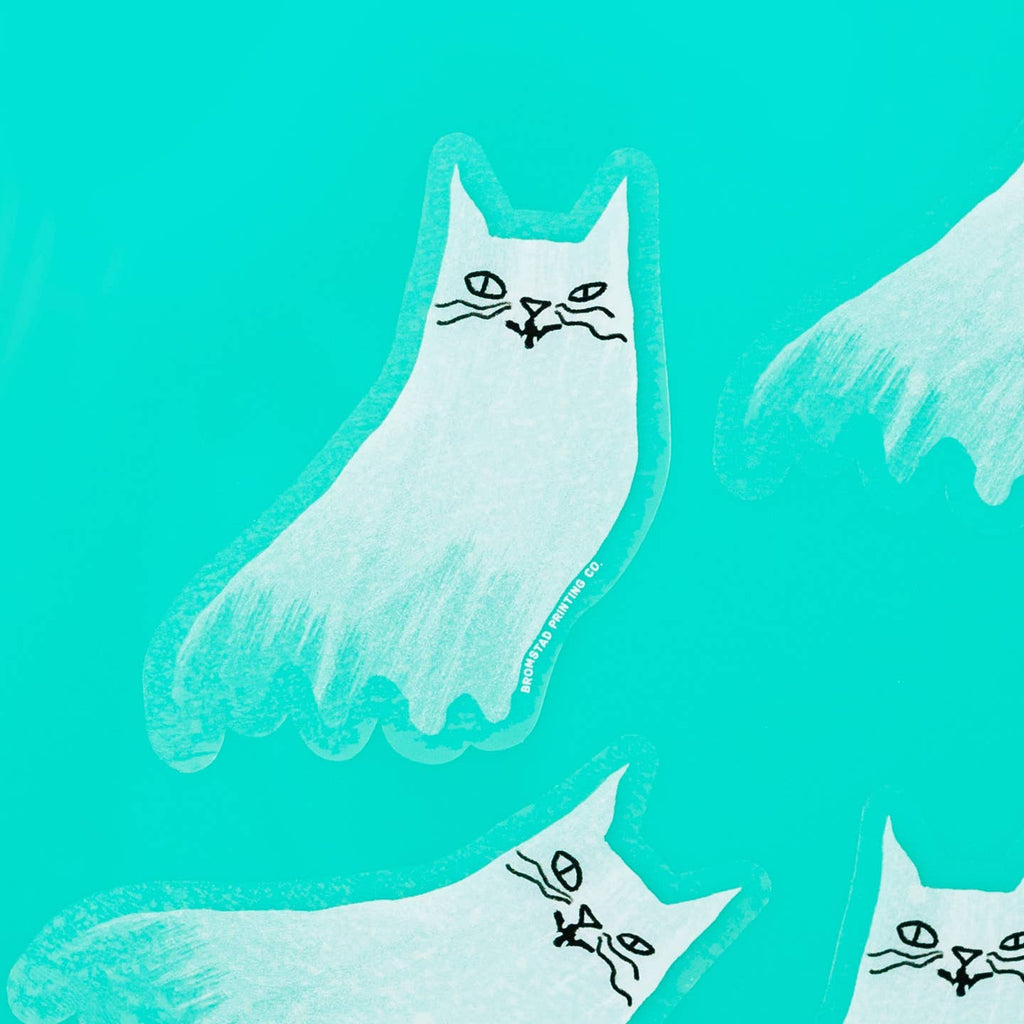 Decorative sticker in the image of a white cat with black features. 