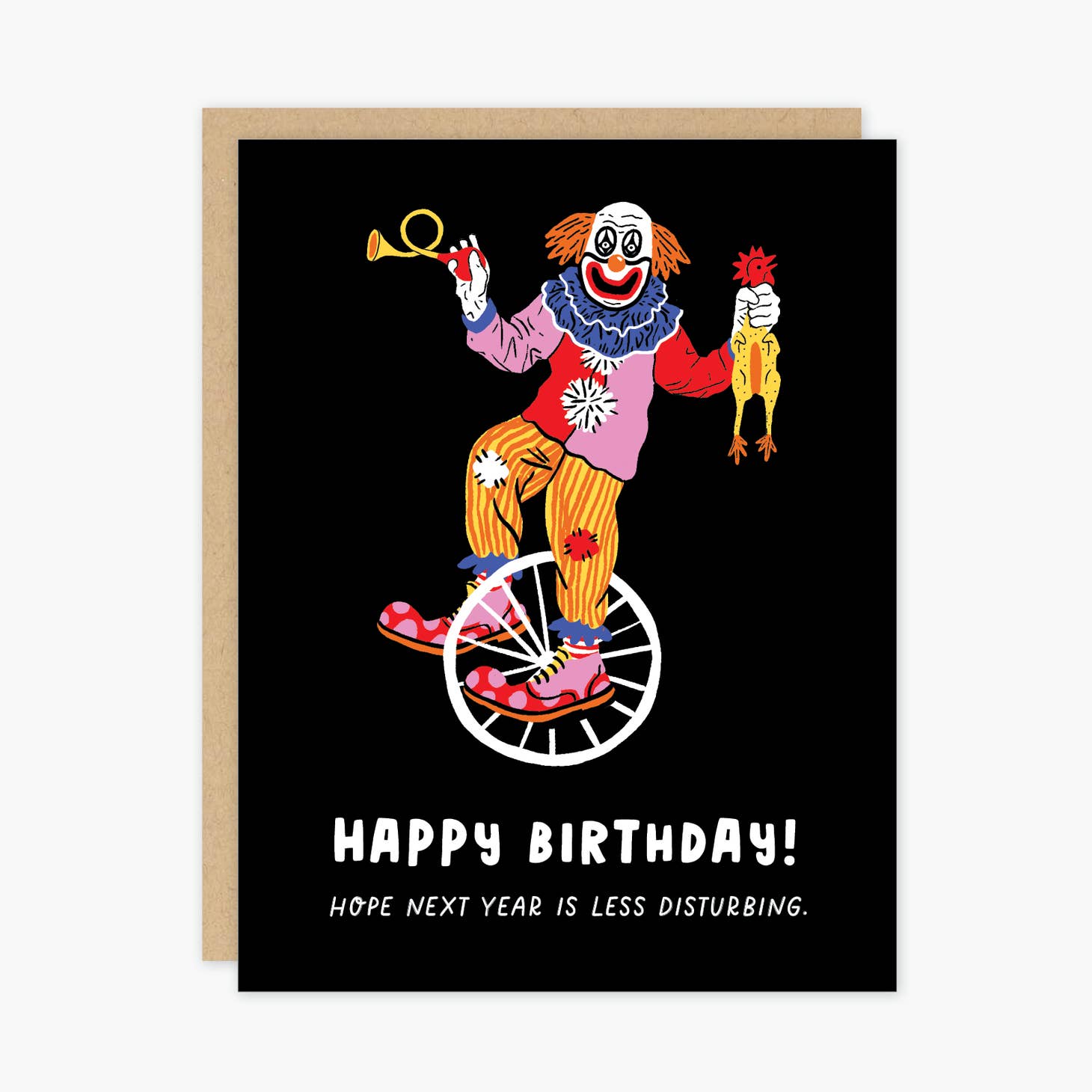 Black background with image of clown riding a unicycle holding a rubber chicken and a horn with white text says, "Happy Birthday! hope next year is less disturbing". Kraft envelope included. 