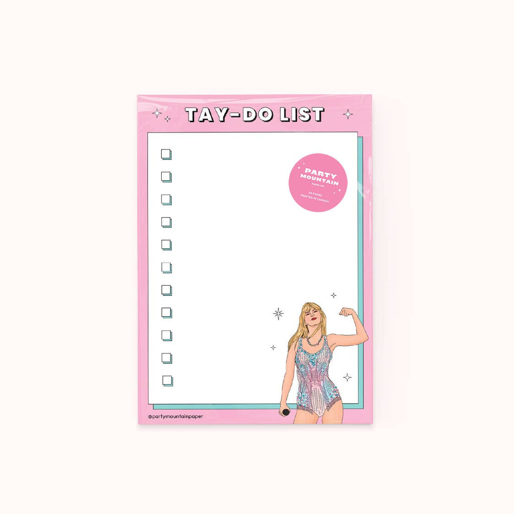 Notepad with white background and pink border with image of Taylor Swift in the lower right hand corner making a muscle with her arm and white text says, "Tay-Do list". there are check boxes in the white field of the notepad. 