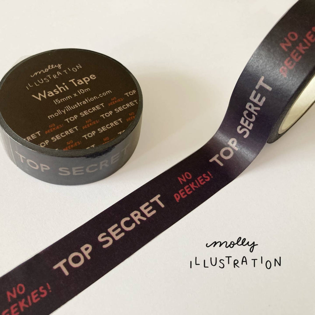Decorative tape with black background and grey text says, "top secret" and red text says, "No peekies!"