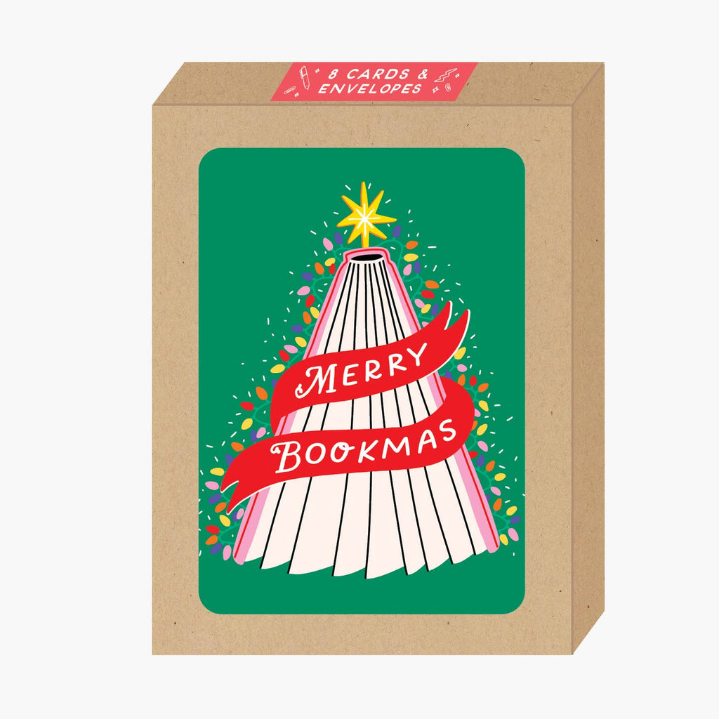 Boxed set of greeting cards with green background and image of a pink book spread at the bottom to resemble a holiday tree with yellow star on top binding and lights on sides. Red banner with white text says, "Merry Bookmas". Envelopes included. 