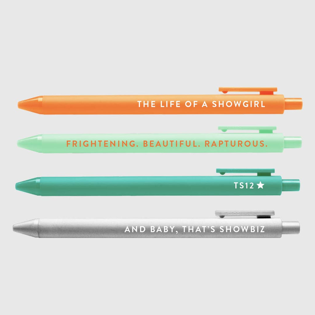 Image of pen set with orange pen says, "The life of a showgirl", mint pen says, "Frightening, beautiful, rapturous", Teal pen says, "TS12", and silver  pen says, "And baby, that's showbiz". 