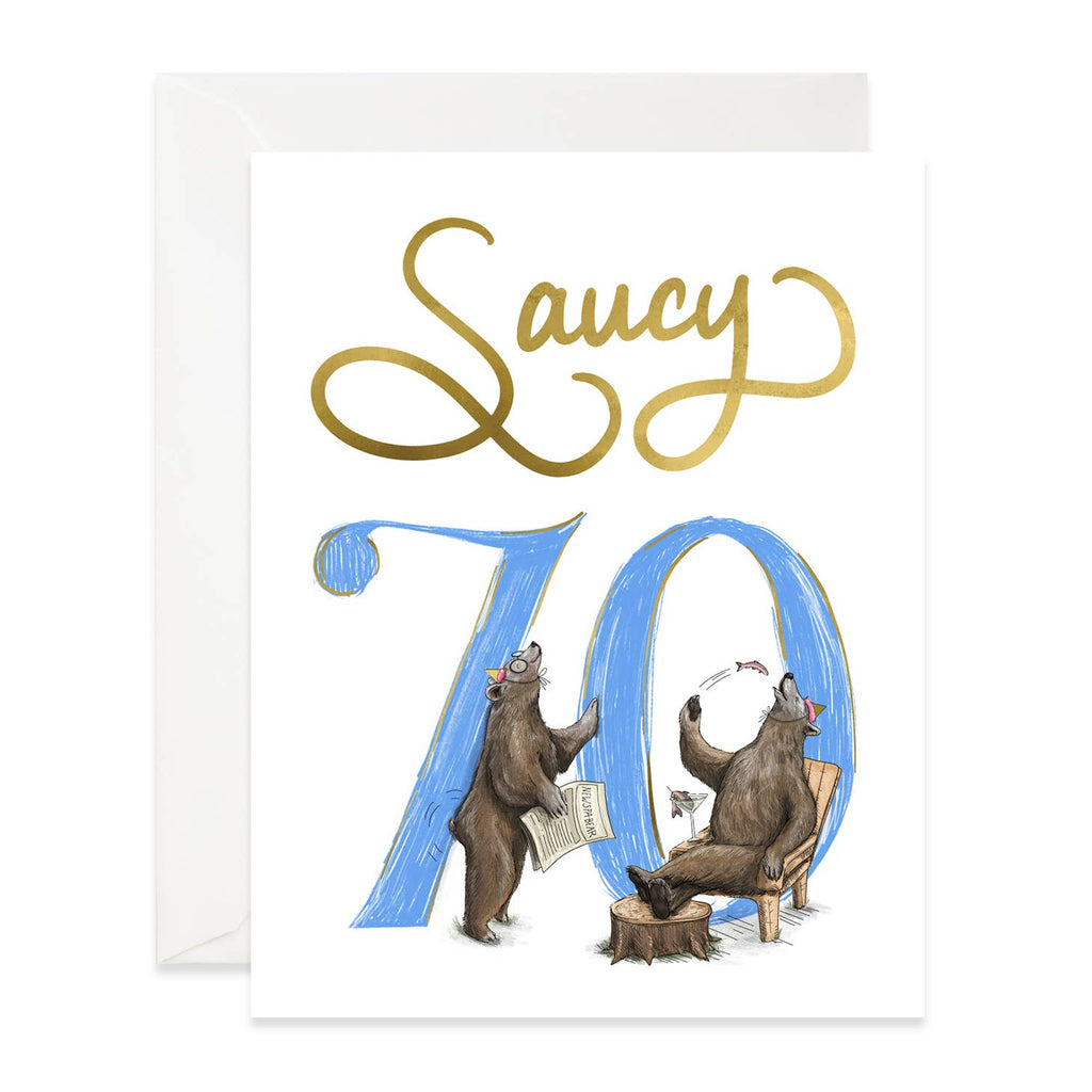 White background with image of blue "70" with tow brown bears tossing fish into their mouth and wearing party hats.  Gold text says, "Saucy". White envelope included. 