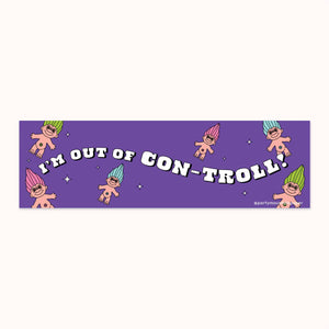 Bumper sticker with purple background and images of troll dolls with blue, pink and green hair. White text says, "I'm out of con-troll!". 