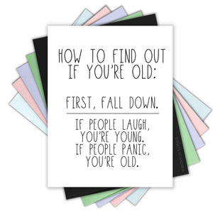 White background with black text says, “How to find out if you are old: First, Fall down. If people laugh, you’re young. If people panic, you’re old!”. An envelope is included.             