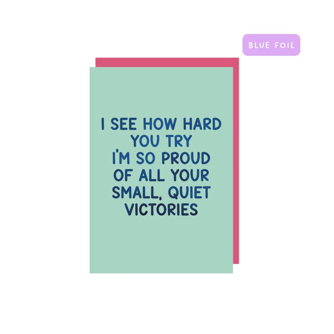 Greeting card with aqua background and blue foil text says, "I see how hard you try I'm so proud of all your small, quiet victories". Pink envelope included.