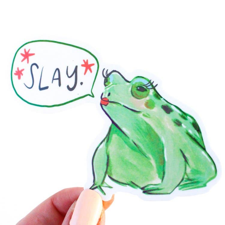 Image of a green frog sticker wearing red lipstick and fake eyelashes with word bubble that says, "Slay". 