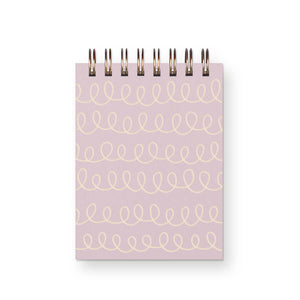 Note pad with coiled binding at top and pink background with cream swirls in lines. 