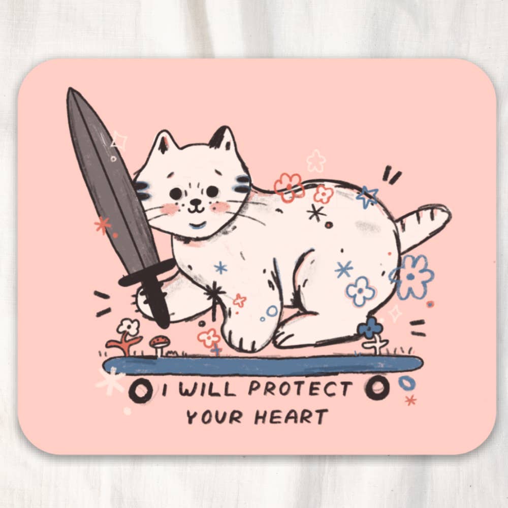 Sticker with pink background and image of a white cat riding on a blue skateboard holding a knife with black text says, "I will protect your heart". 