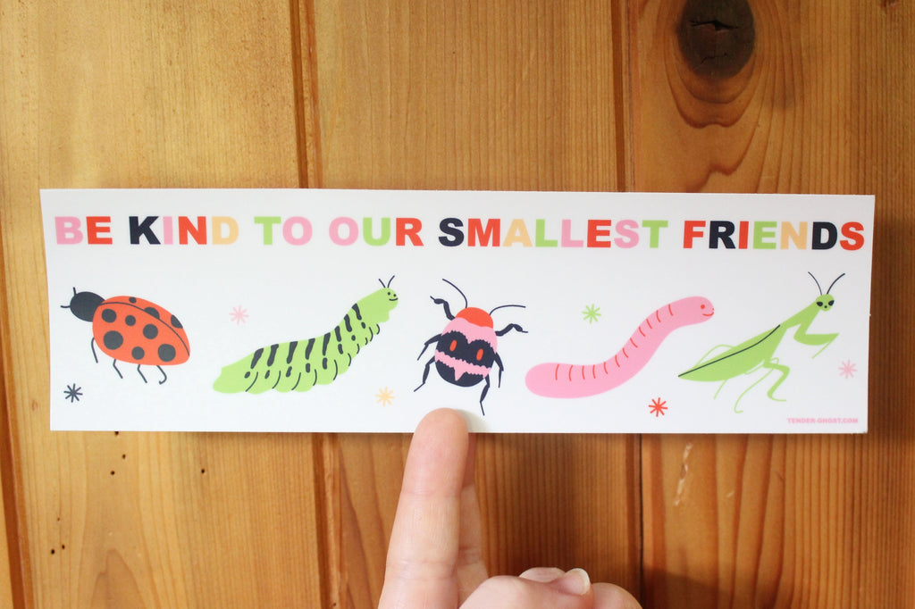 Bumper sticker with white background and images of ladybug, caterpillar, beetle, worm and praying mantis with multicolored text says, "Be kind to our smallest friends". 