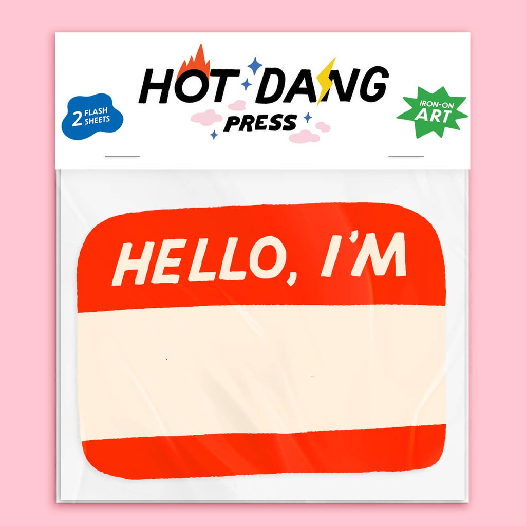 Image of an iron on transfer in the shape of a name sticker in red and white text says, "Hello, I'm". 