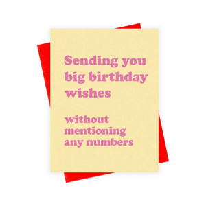 Greeting card with yellow background and pink text says, "Sending you big birthday wishes without mentioning any numbers". Red envelope included. 