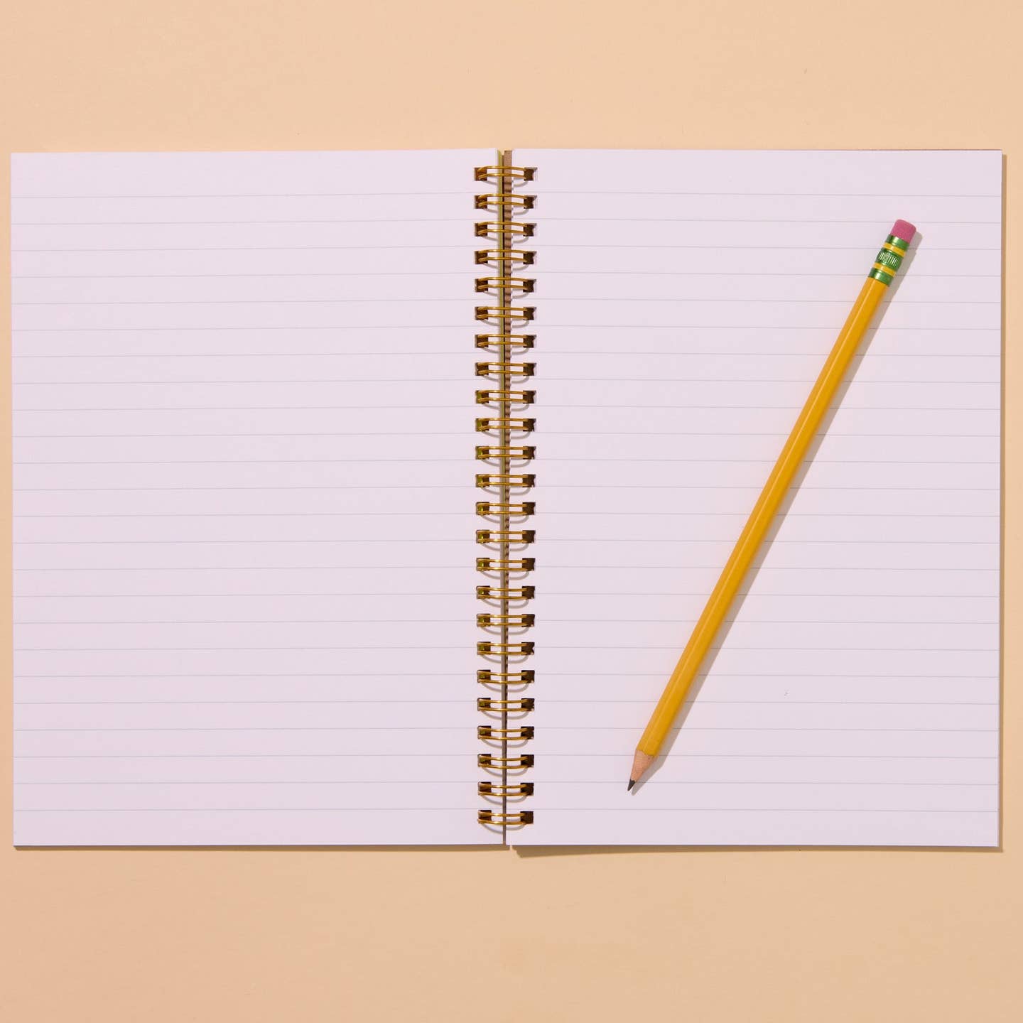 Notebook with white background and pale blue stripes. 