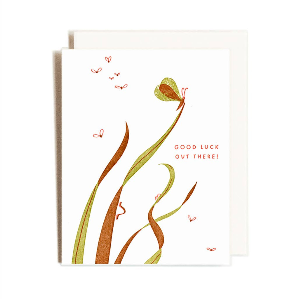 greeting card with a bug on top of tall grass. Text says "good luck out there"
