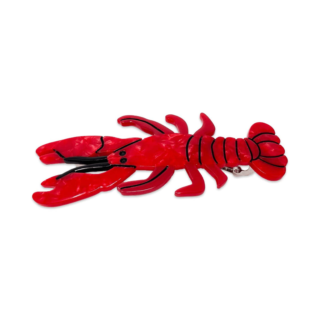 Barrette in image of a red lobster with black details. 