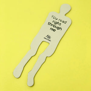 Image of back of skeleton bookmark. Black text says, "You read right through me". 