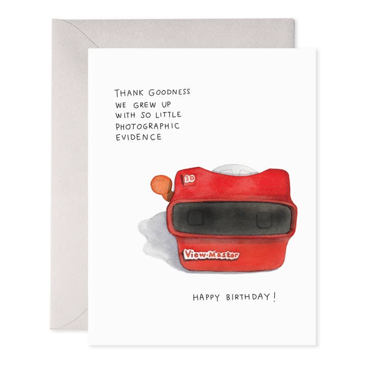 Greeting card with white background and image of a viewfinder with black text says, Thank goodness we grew up with so little photographic evidence, Happy Birthday!". Grey envelope included.