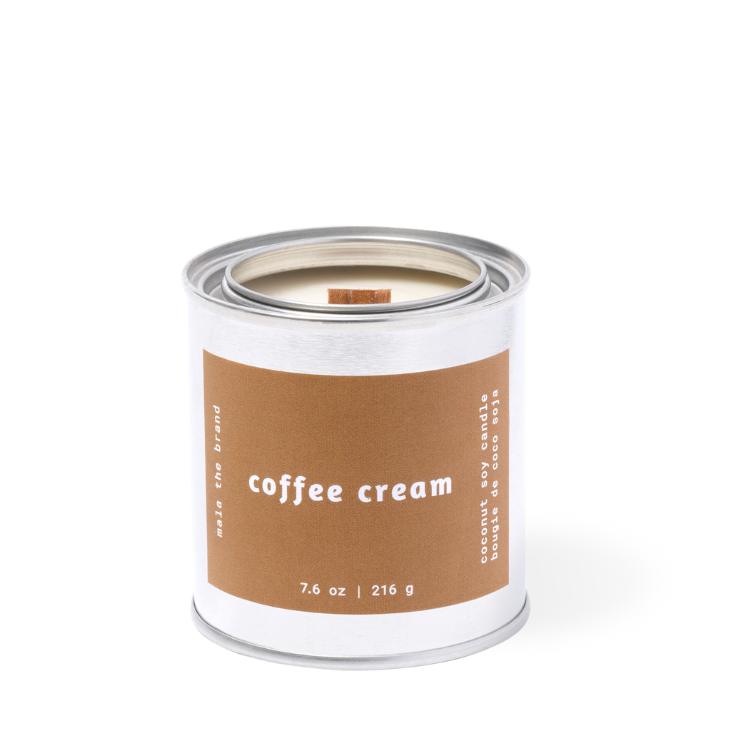 Image of candle with brown label and white text says, "Coffee cream". 