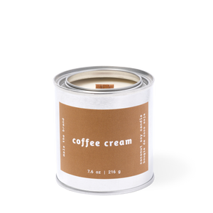 Image of candle with brown label and white text says, "Coffee cream". 