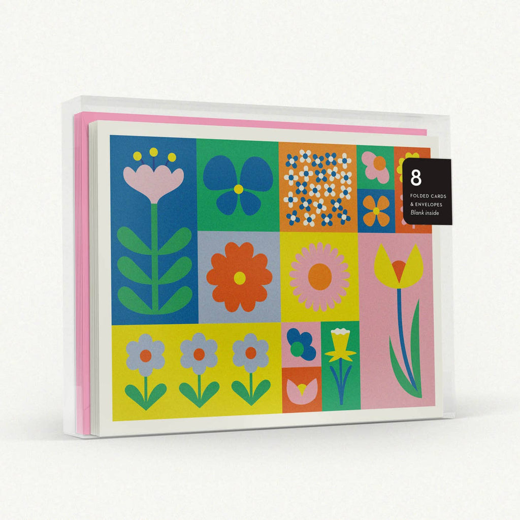 Image of boxed note cards with images of flowers and pink envelopes. 