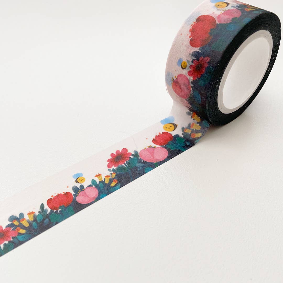 Image of wide Washi tape with images of pink and red flowers with yellow and black bees and green foliage,.