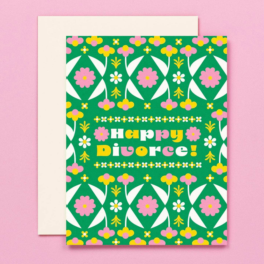 Greeting card with green background and floral pattern in pink, yellow and white with text that says, "Happy Divorce!". Envelope included.