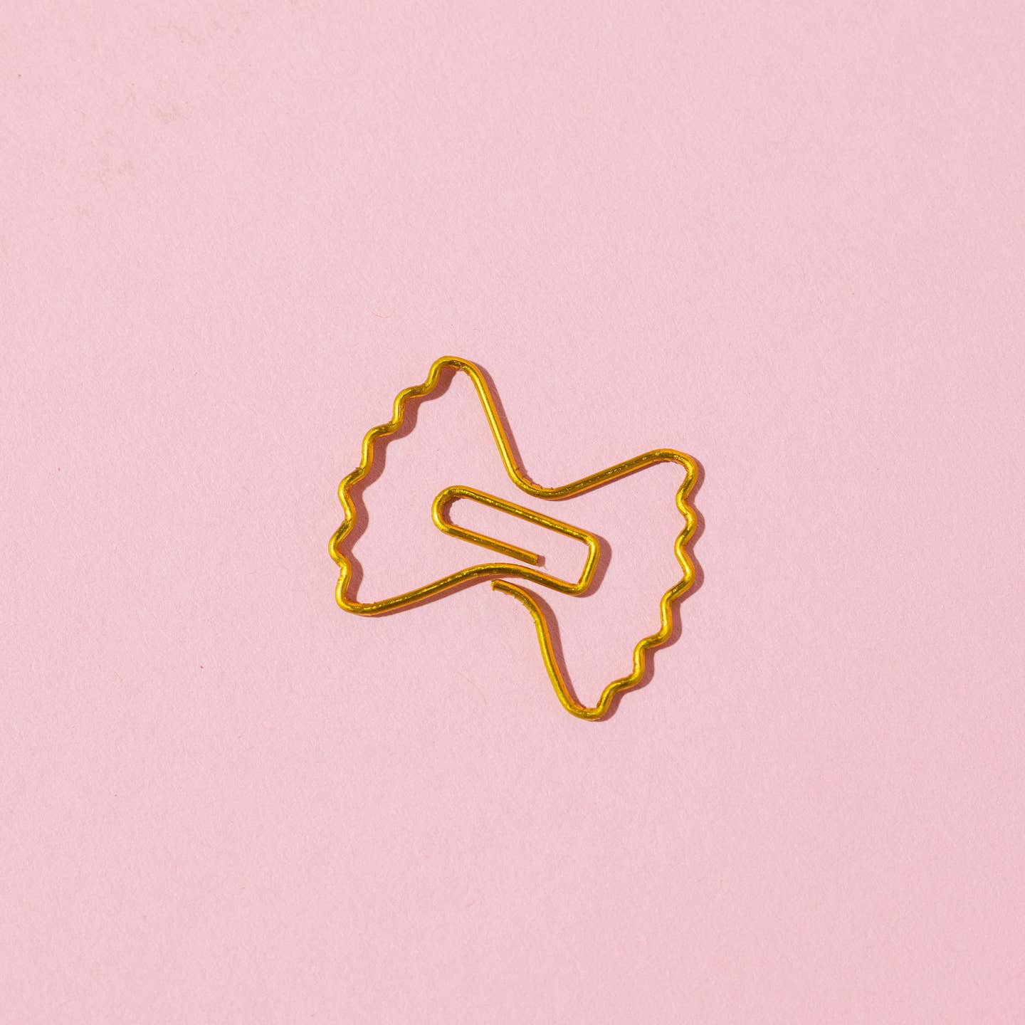 Paper clip in the shape of a bow tie pasta.