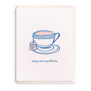 Greeting card with white background and image of a blue tea cup and saucer. Blue text says, "Always here to spill the tea" and tea bag tag says, "English Bitch fest". Envelope included.