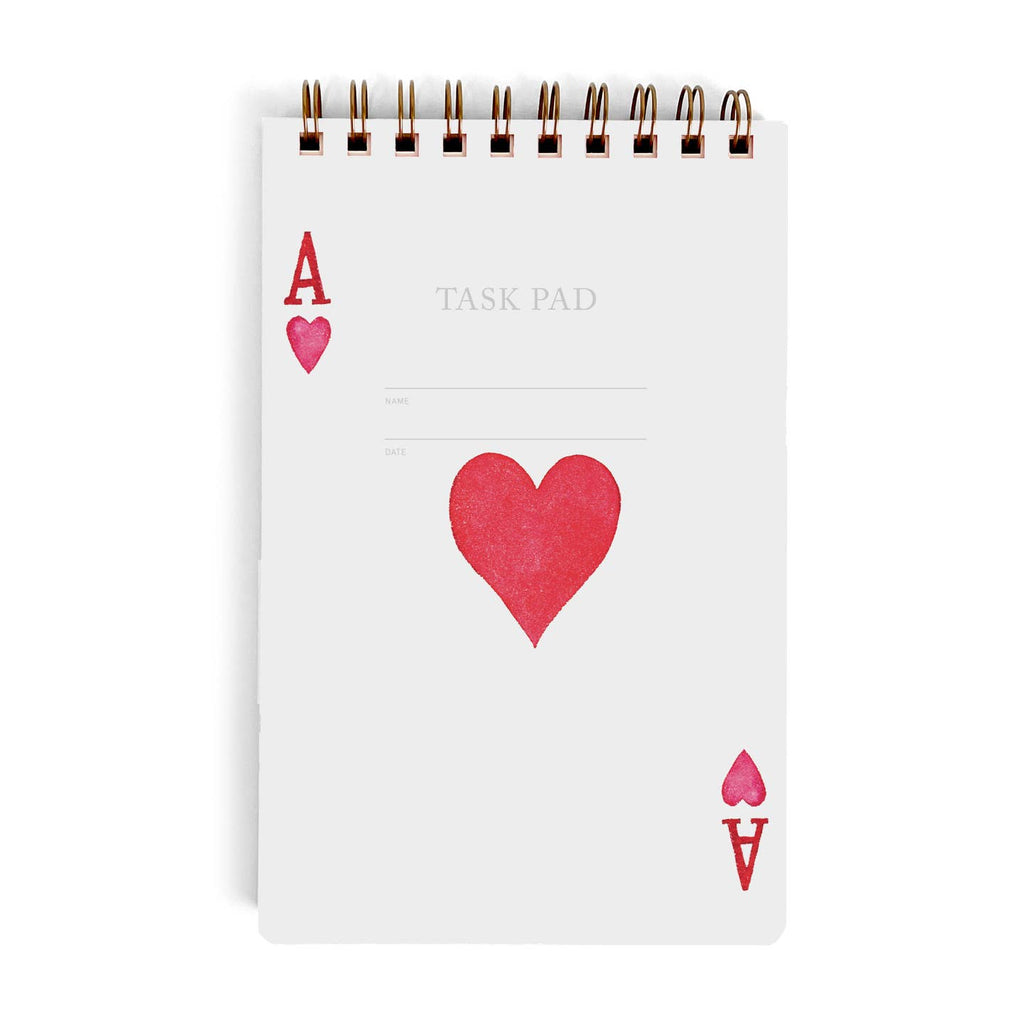 Task pad with white background and image of red heart in middle of pad and "A' with red heart at upper left corner and at lower right corner with metal coil binding at top of pad. 