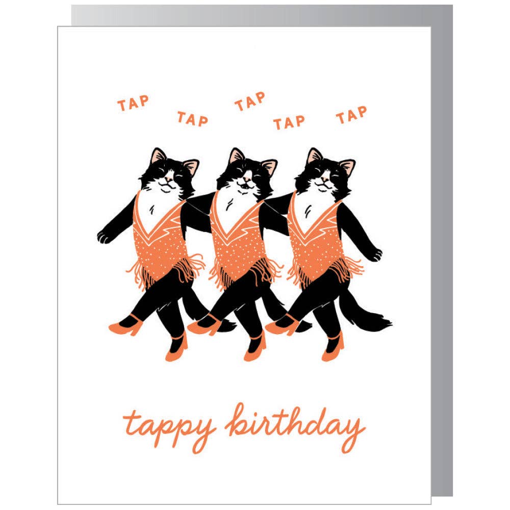 Greeting card with white background and image of three black and white cats dressed in dance costumes wearing tap shoes. Pink text says, "tap, tap, tap, tap, tap" and "tappy birthday". Grey envelope included. 