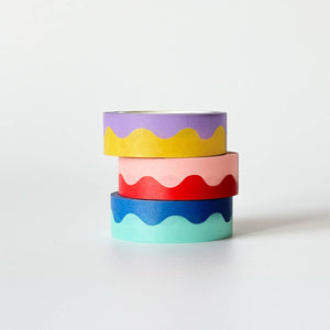Stack of washi tape with squiggle line in middle. Color of each lilac and yellow, pink and red, and blue and aqua. 
