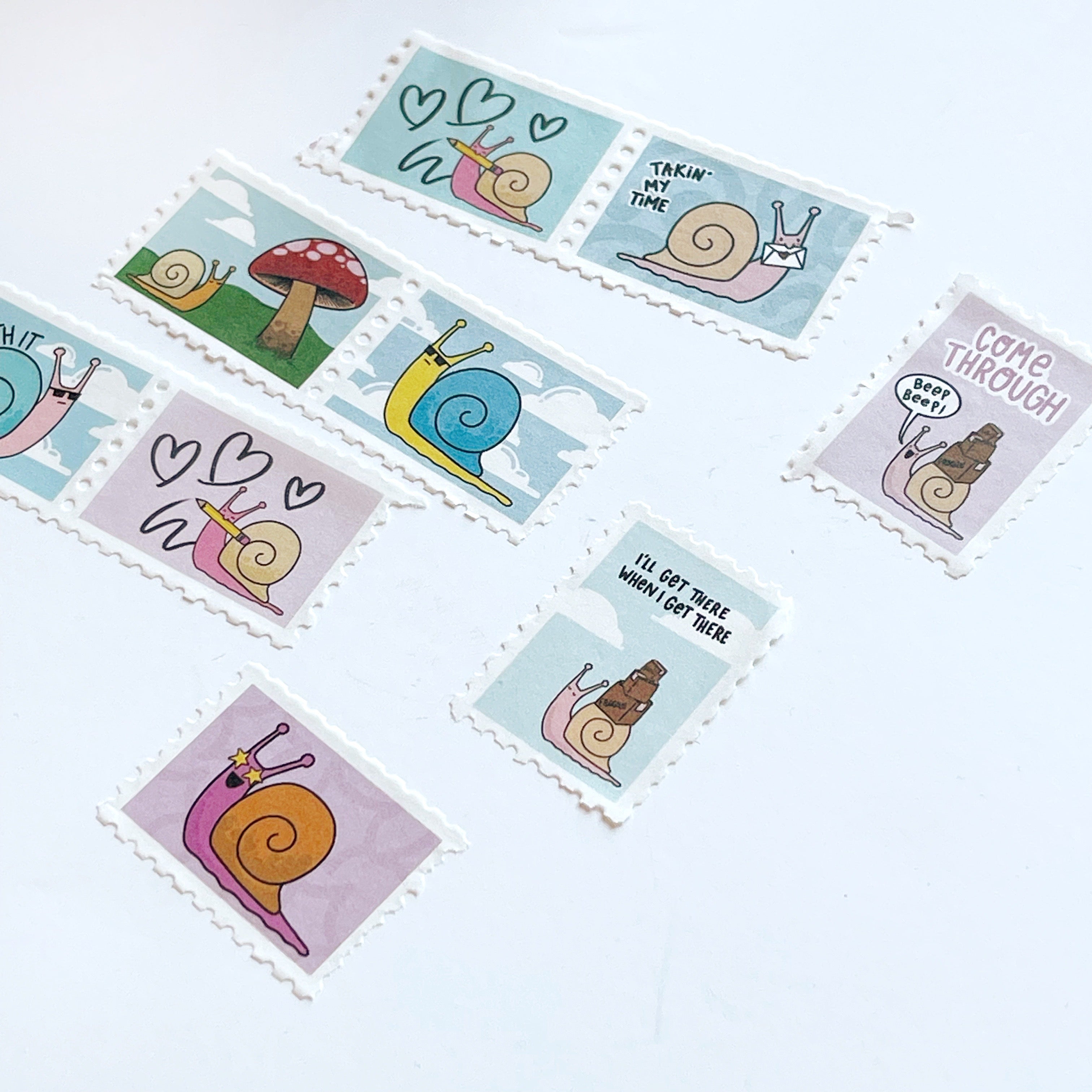 Images of stamp Washi tape with image of Ernie the snail in various scenes.