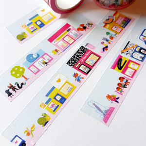Image of wide washi tape with images of village shops on pink and blue background.