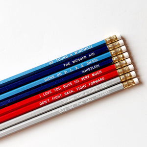 Image of pencil set in blue, red white, white text says, "We Found A Windmill! ","The Wonder Kid ","Dicks on 3! 1, 2, 3, Dicks! ","Whistle!! ","I Love You Guys So Very Much ","Don't Fight Back, Fight Forward ","Thank You & Fuck You","Give Me The Ball Please!".