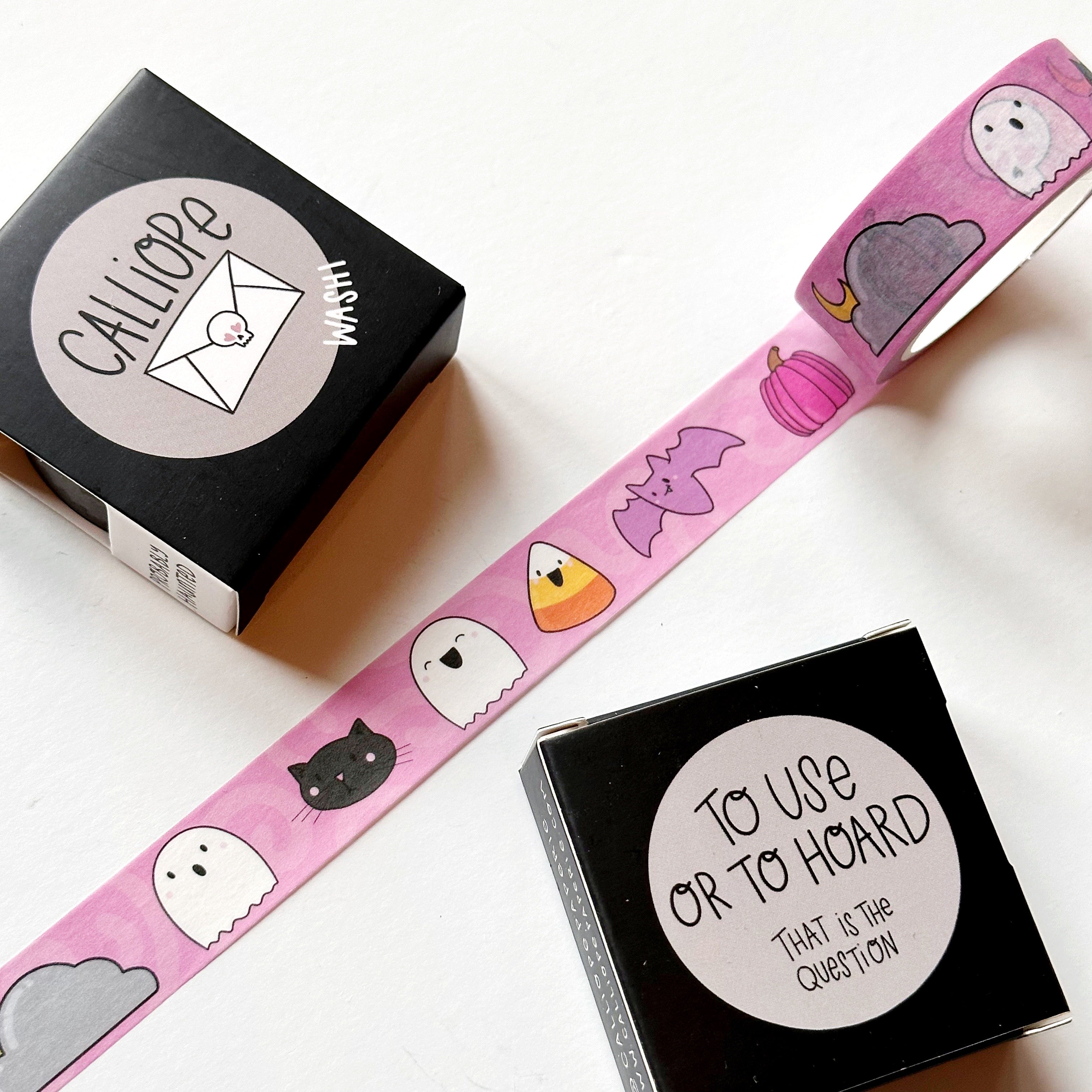 Image of Washi tape with pink background and images of purple bat, black cat, white ghost, candy corn, and grey cloud.
