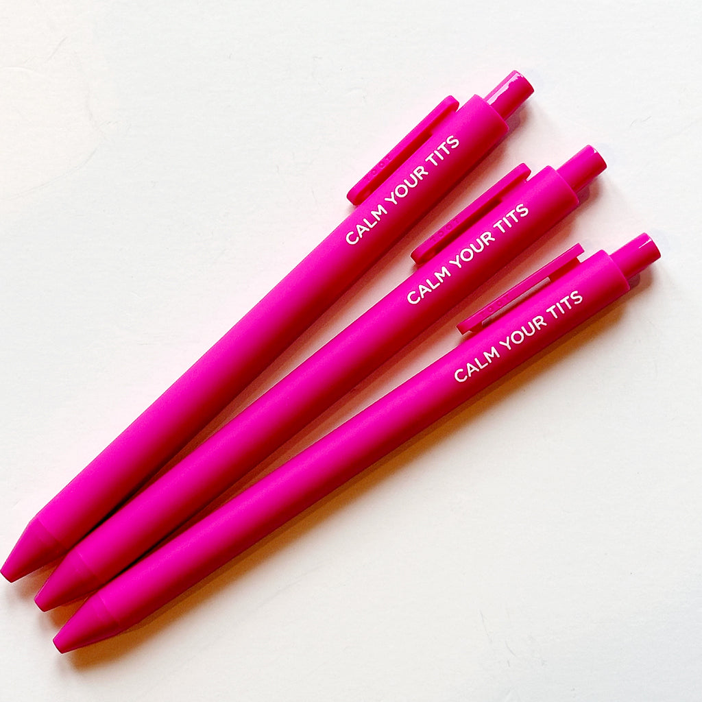 Image of three bright pink pens with white text says, "Calm you tits". 