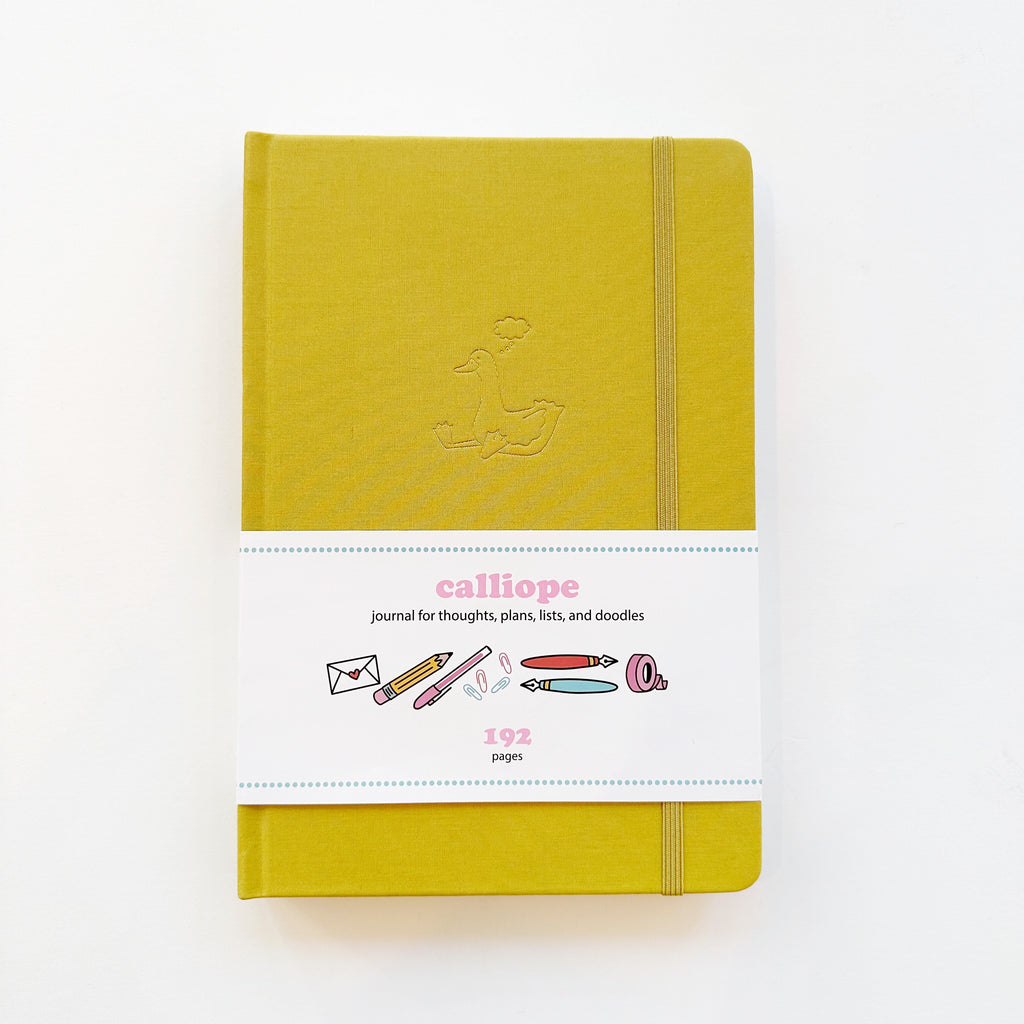 Image of chartreuse journal with gold foil duck with word bubble over his head. 