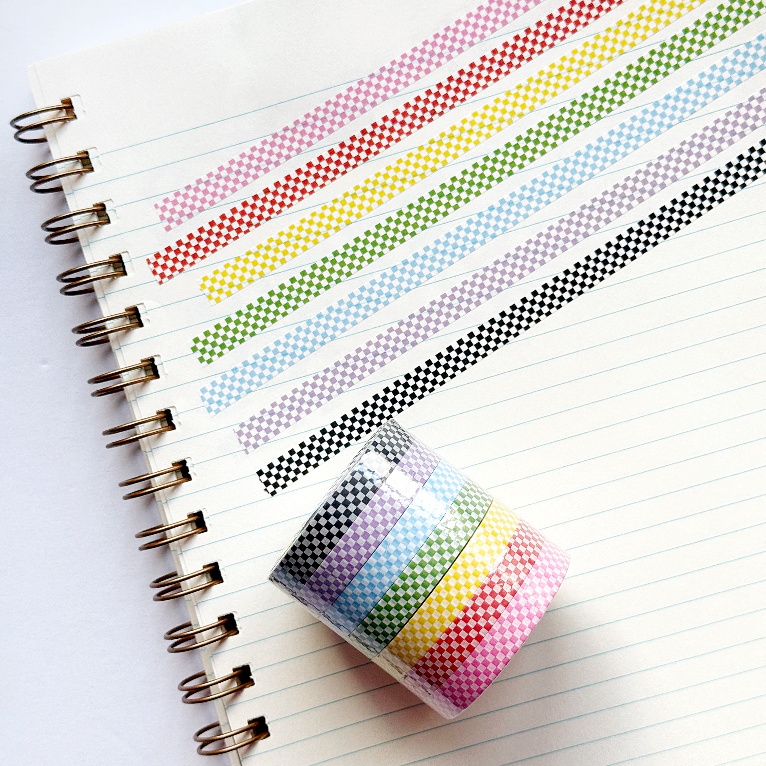 Images of  checkerboard patterned washi tape in pink and white, red and white, yellow and white, green and white, blue and white, lilac and white and black and white.