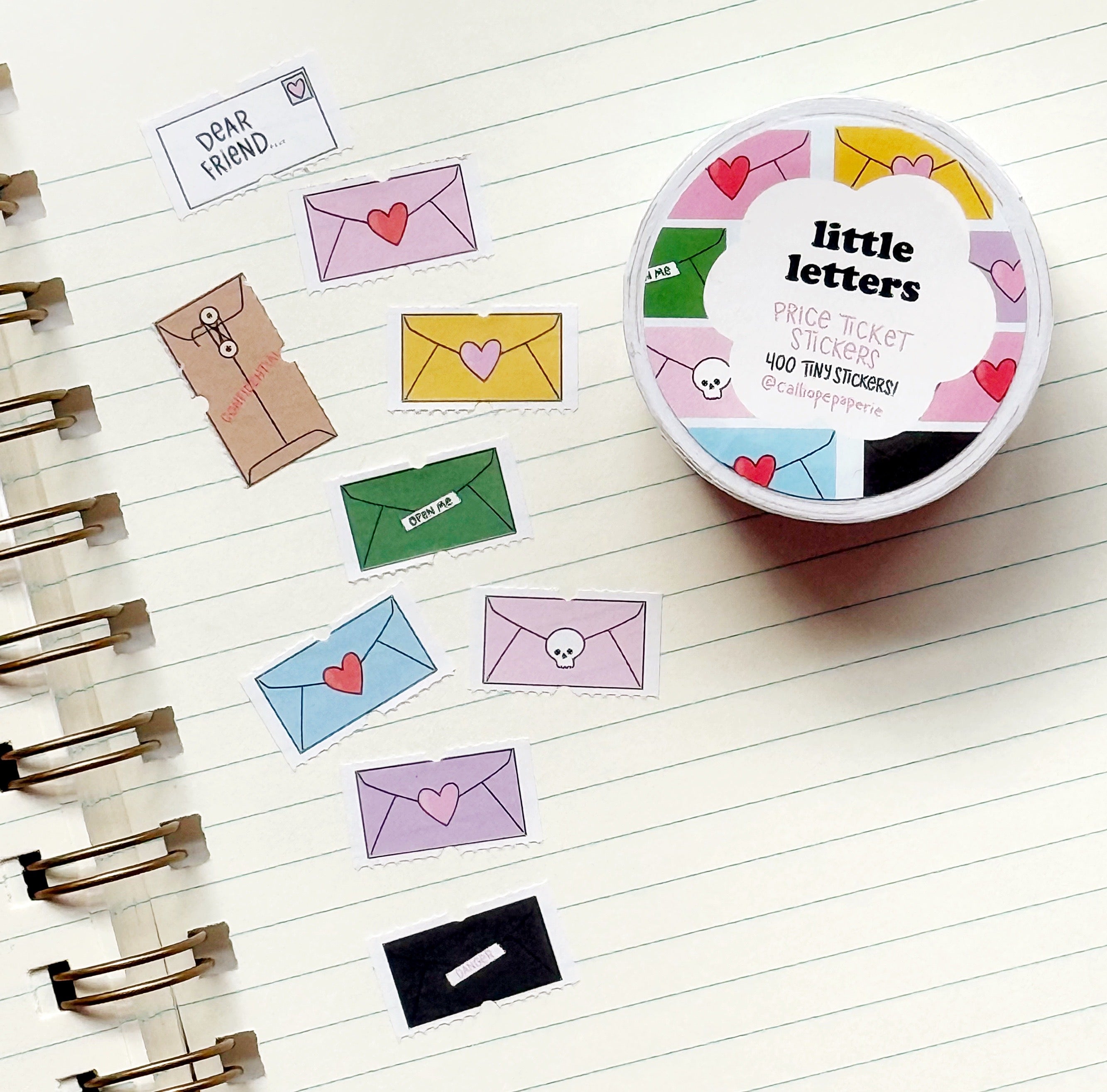 Image of tiny decorative stickers with images of envelopes in bright and pastel colors.