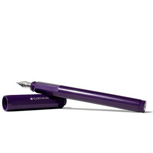 purple fountain pen with silver nib resting on purple cap 