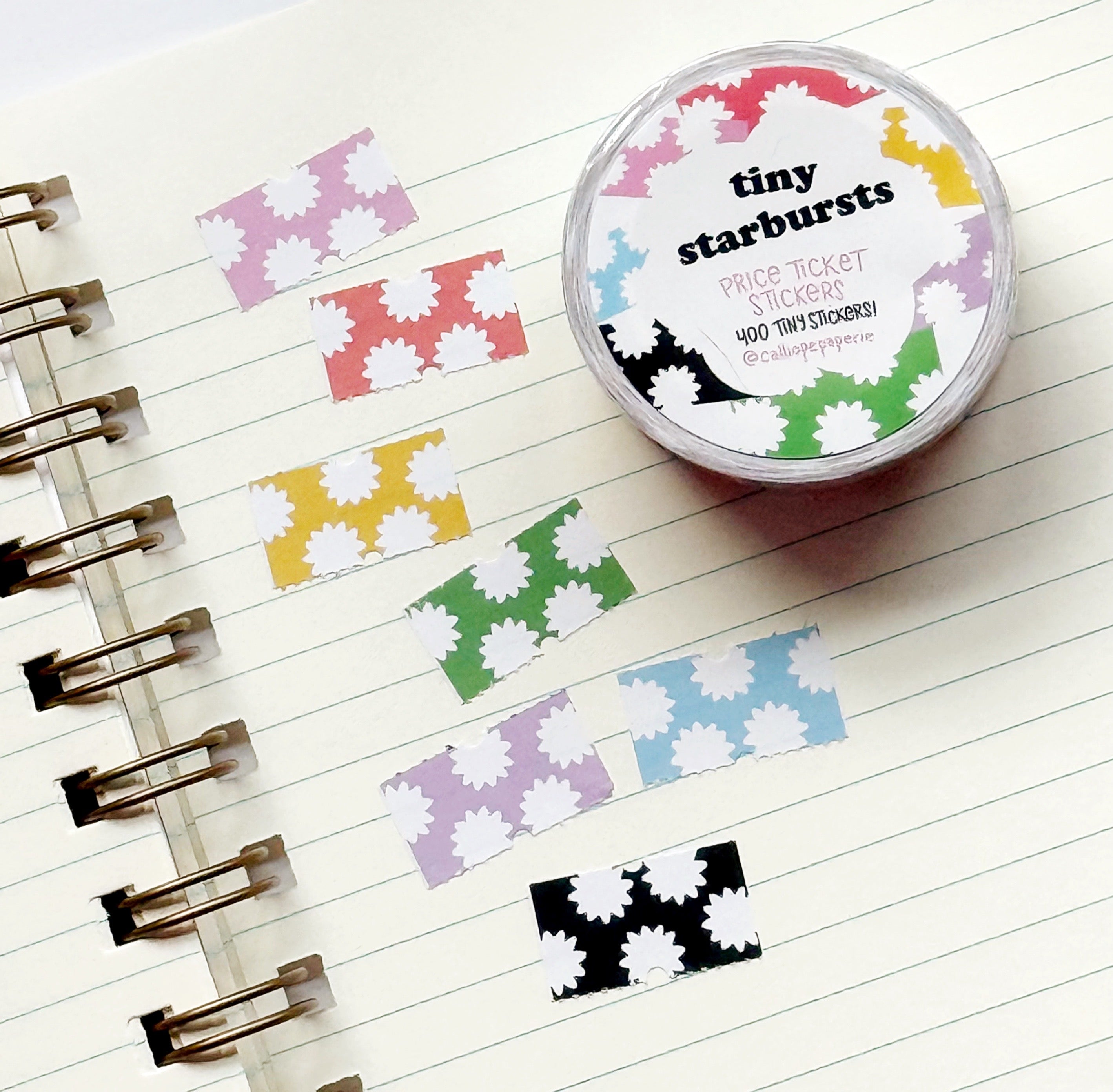 Images of  starburst patterned tiny stickers in pink and white, red and white, yellow and white, green and white, blue and white, lilac and white and black and white.