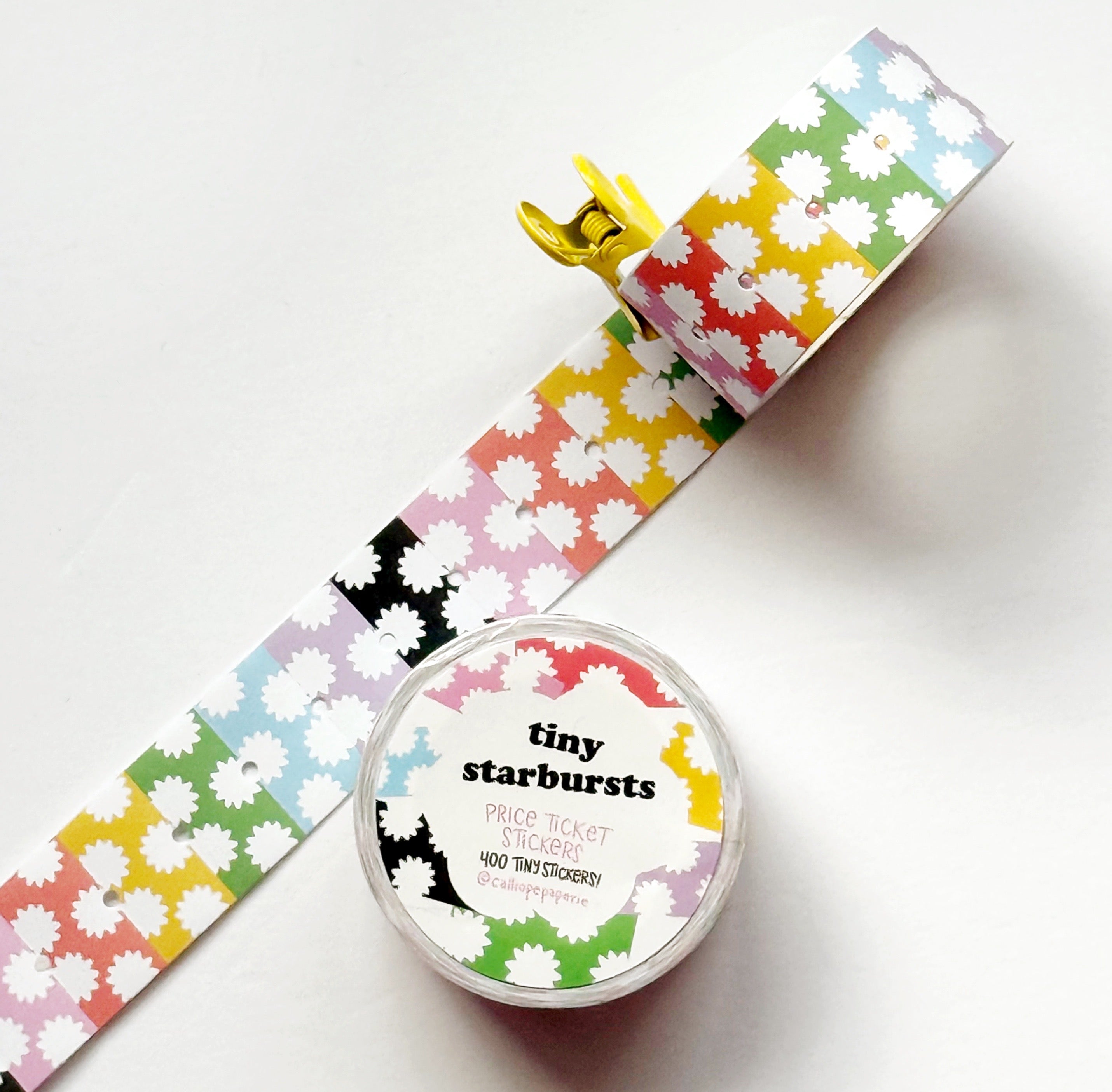 Images of  starburst patterned tiny stickers in pink and white, red and white, yellow and white, green and white, blue and white, lilac and white and black and white.