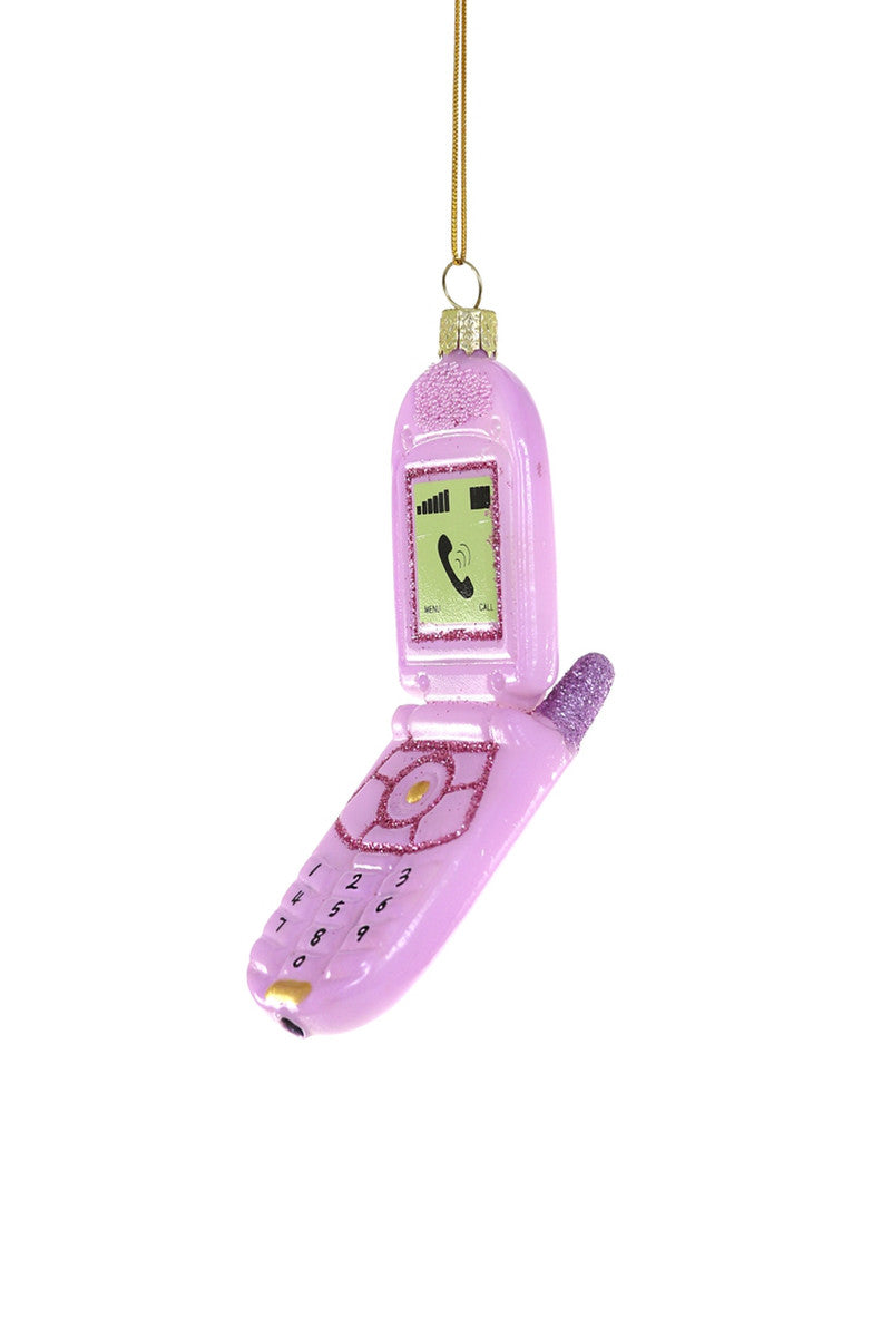 Image of pink flip phone with yellow screen and  black numbers. 