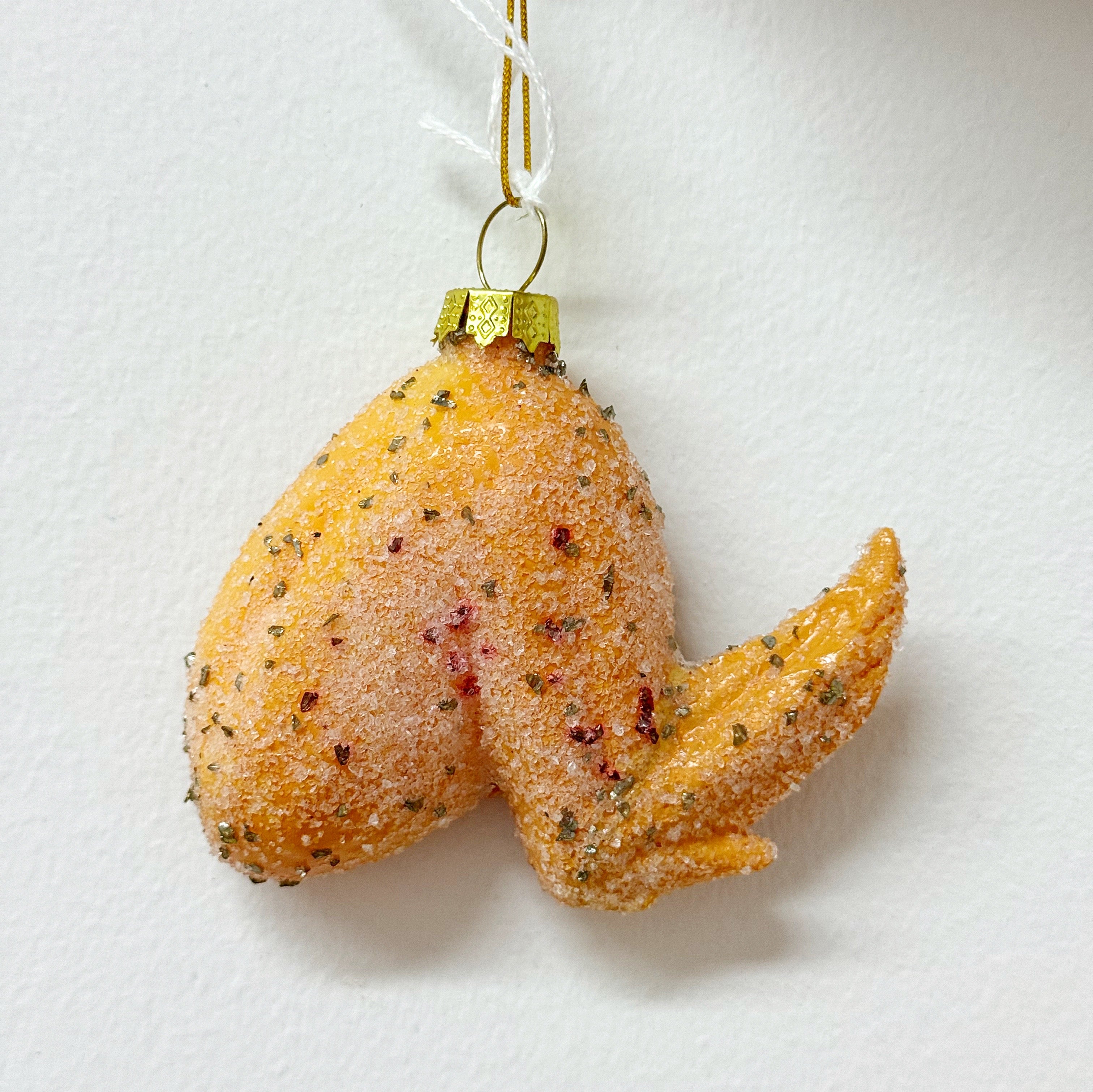Ornament in the image of a chicken wing.