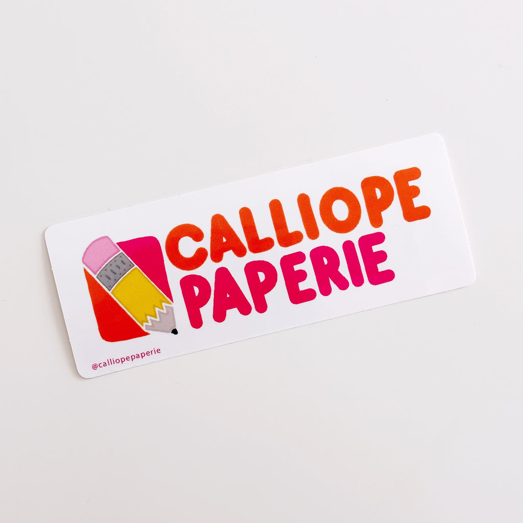 White background with image of yellow stubby pencil with pink eraser and orange and pink text in style of Dunkin' says, "Calliope Paperie". 
