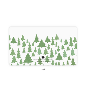 Image of back of notecard with white background and images of green pine trees. 
