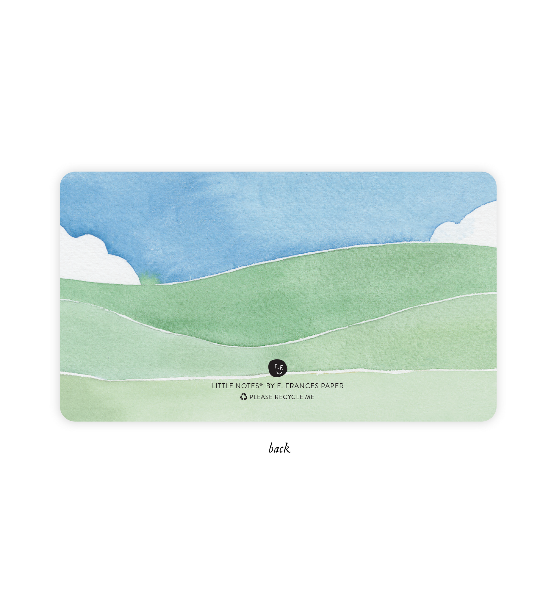 Image of back of little note with blue sky with white clouds and shades of green as rolling hills. 